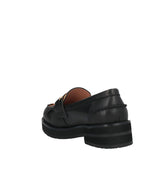 TINA Mocasín track con flecos combi negro