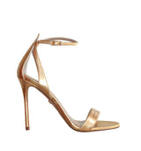 Sandalia alta con talón en oro